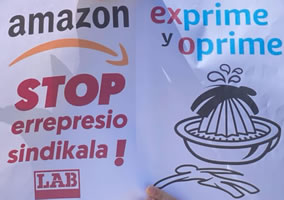 „Amazon exprime y reprime“ (Amazon drückt und unterdrückt) im baskischen Amazon-Lager DQB2 Trapagaran/Swansea